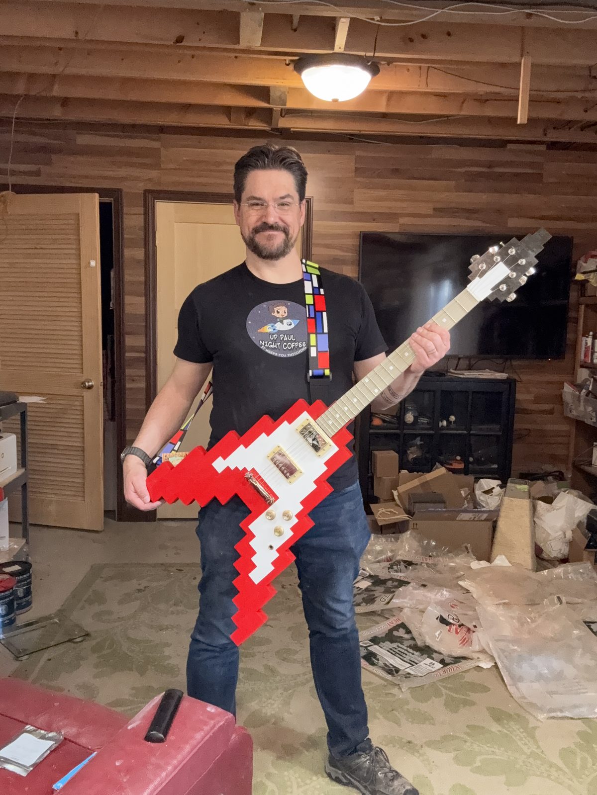 Paul with a pixel art guitar build